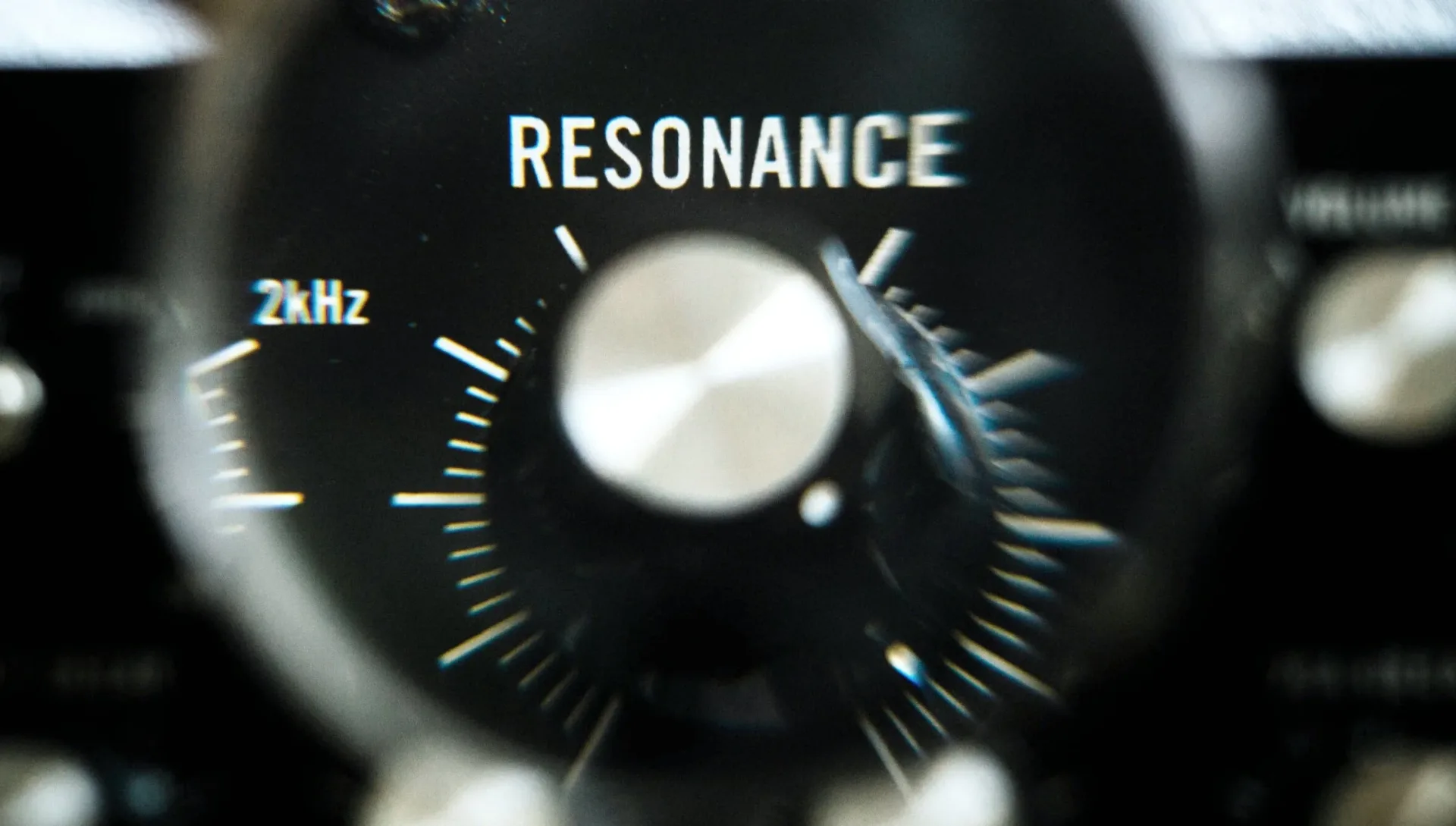 Macro photograph of a vintage analogue resonance control in low light